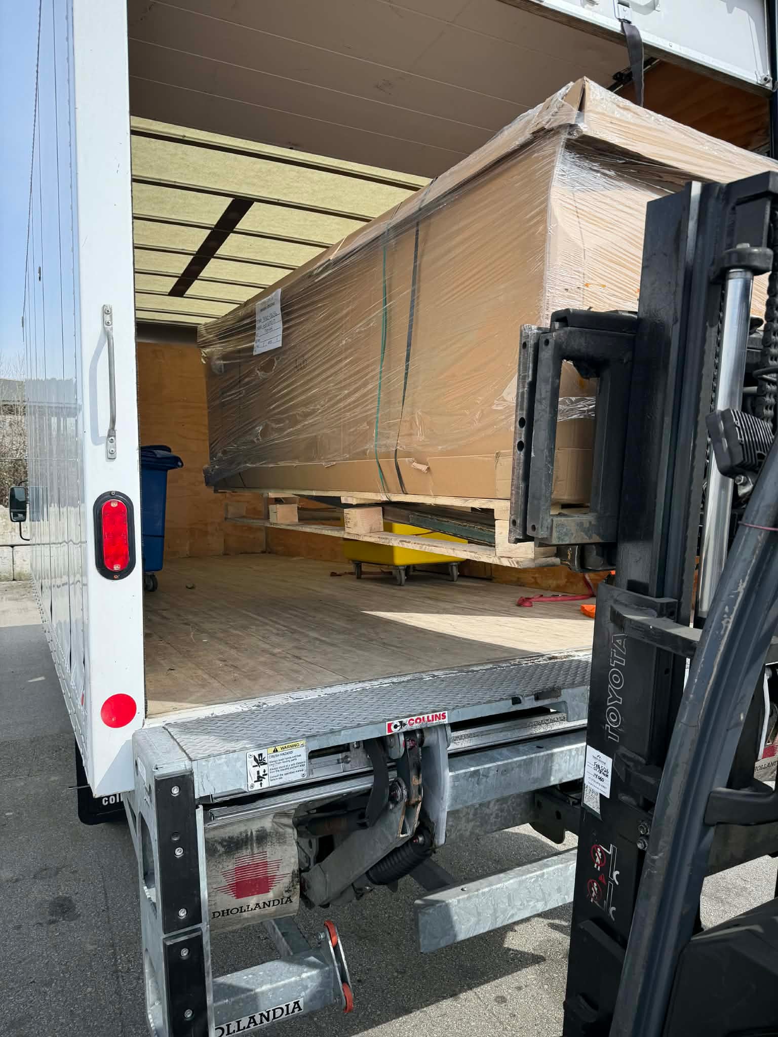 Moving crew loading heavy furniture as a team