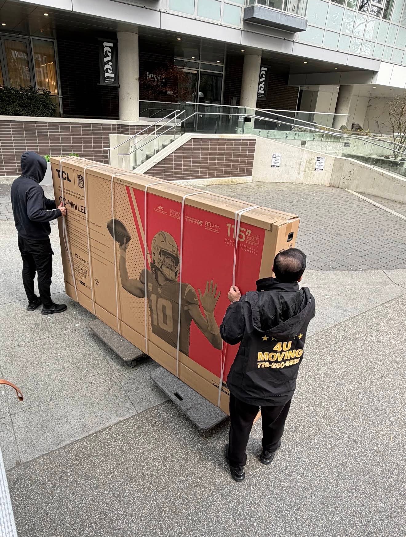 Professional movers organizing boxes on moving day